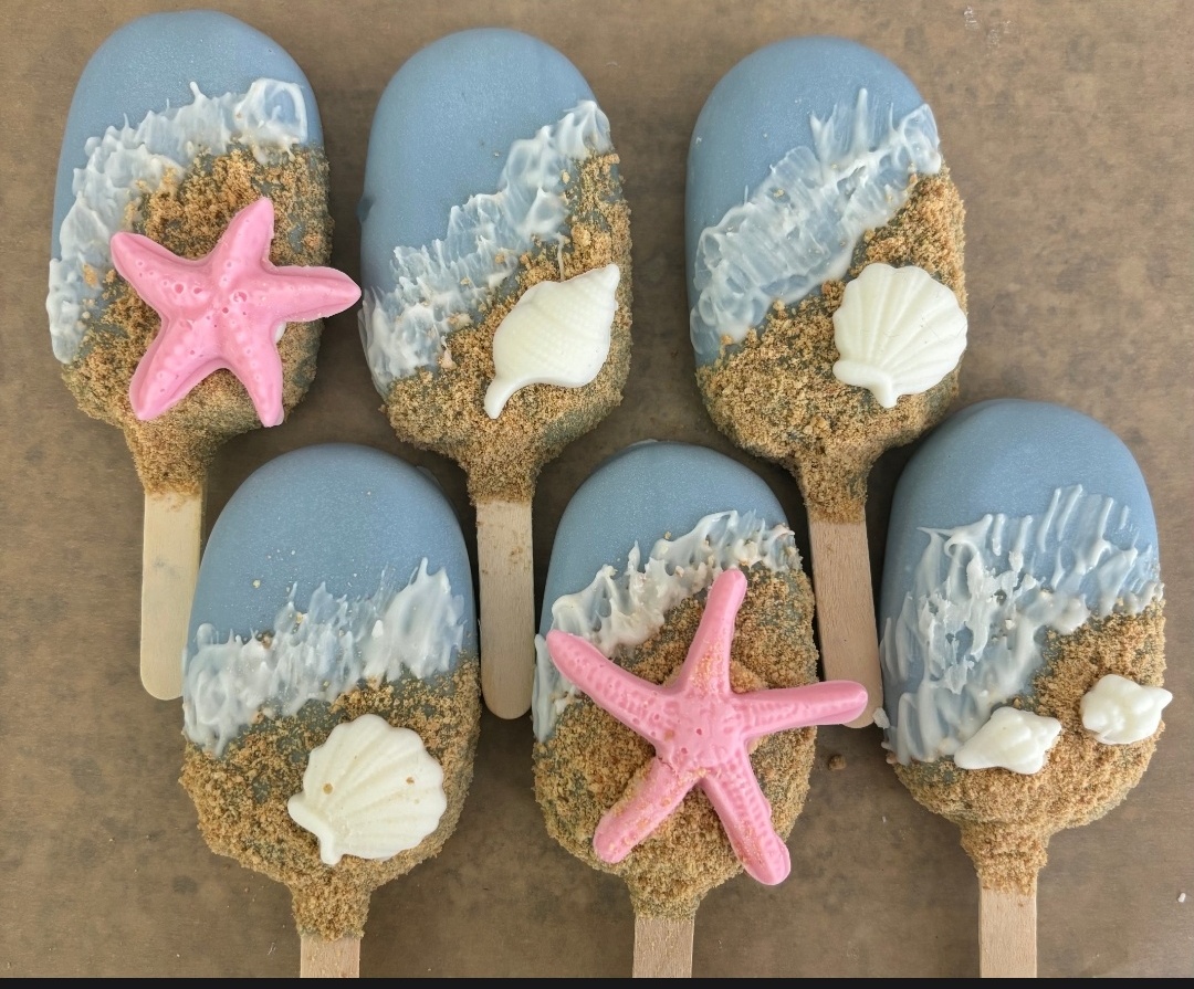 Beach themed cakesicles with starfish and seashells