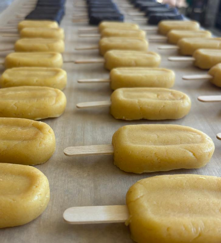 Fresh baked cakesicles cooling on parchment